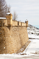 Fortified walls of the village of Mont-Louis covered with snow