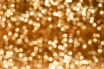 Shiny golden light patches, reflexes, reflextions and glow. Abstract defocused background