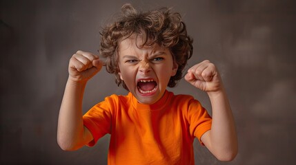 Fiery fury: Child's face flushes with anger, fists clenched in frustration. - obrazy, fototapety, plakaty