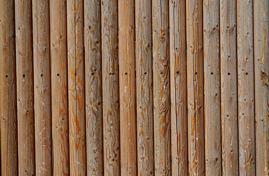 Wall of parallel wooden logs