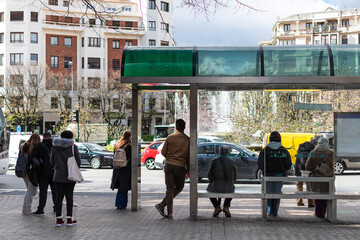 Waiting for the city bus at rush hour. Pamplona