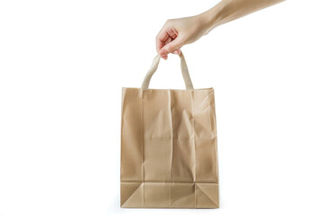Hand holding a recyclable paper bag isolated on a white background