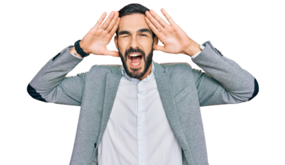 Young hispanic man wearing business clothes smiling cheerful playing peek a boo with hands showing face. surprised and exited