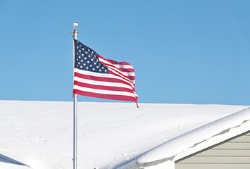 American Flag and Snowy Roof