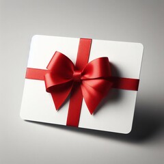 An image featuring a white gift card wrapped beautifully with a red ribbon bow, set against a uniform gray background.