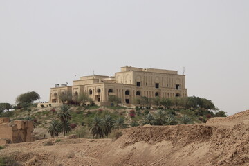 Saddam palace on hill in Babylon with cloudy sky
