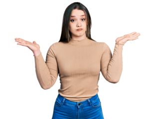 Young hispanic woman wearing casual clothes clueless and confused with open arms, no idea and doubtful face.