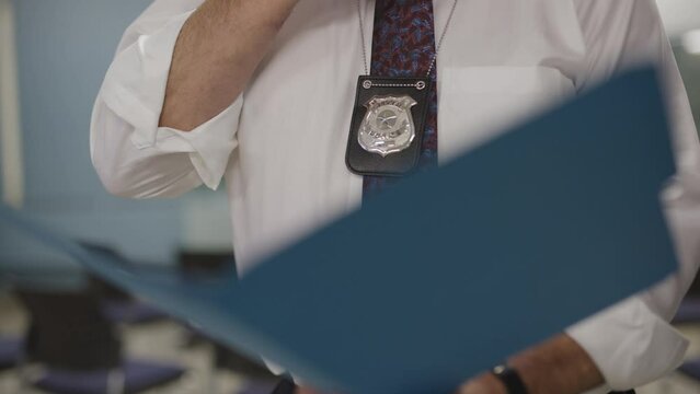 detective reading a briefing on a case file
