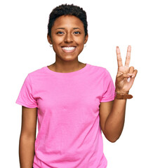Young african american woman wearing casual clothes showing and pointing up with fingers number two while smiling confident and happy.