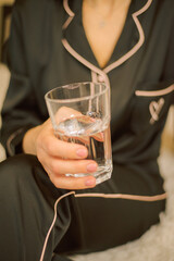 person with glass of water