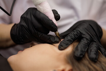 Second PMU procedure in a month of permanent eyebrow makeup. Permanent makeup correction.