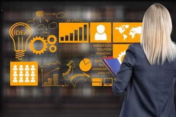 Unrecognizable analyst browsing infographics with statistics report