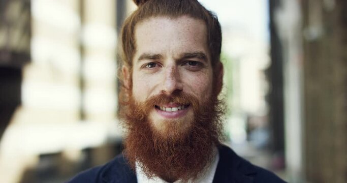 City, face and business man outdoor for travel, beard and confidence in urban town of Ireland. Portrait of a young professional person or Irish model with ginger hair and smile for career journey