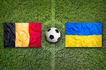 Belgium vs. Ukraine flags on soccer field