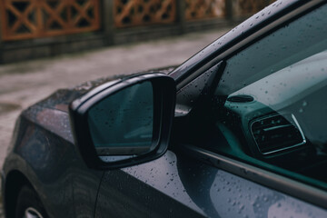 Side rearview mirror of the car in a rain drops - 768157755