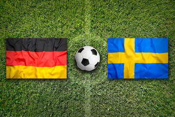 Germany vs. Sweden flags on soccer field