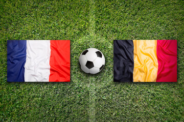 France vs. Belgium flags on soccer field