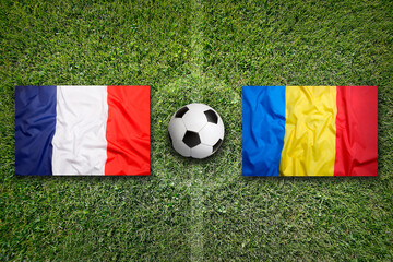 France vs. Romania flags on soccer field