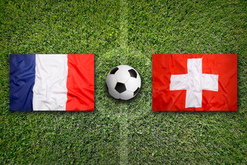 France vs. Switzerland flags on soccer field