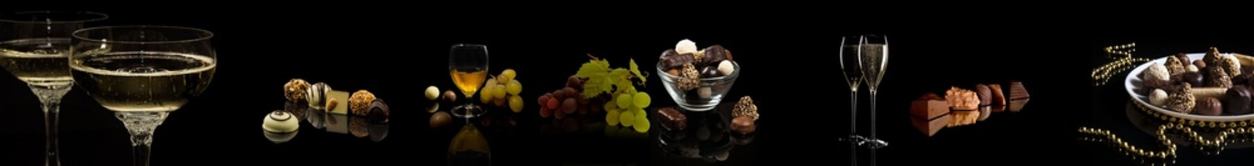 Candies with wine and grapes on a black background