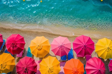 Tuinposter a group of umbrellas on a beach © Ion