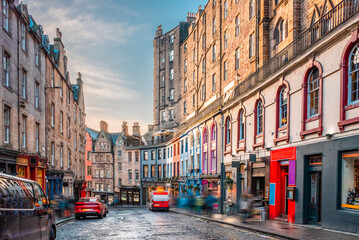 Colorful painted storefronts and old buildings along the famous Victoria Street in Edinburgh Old...