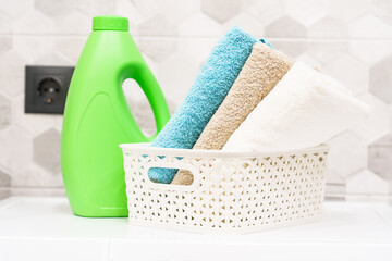 Clean towels and detergent in the laundry or bathroom.