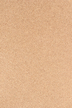 Brown textured cork board background. Textured wooden background. vertical cork board with copy space.