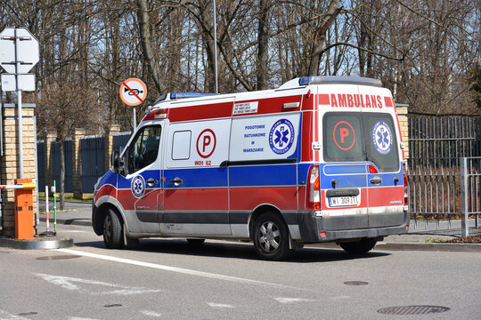 Ambulance (Ambulans) van moving on the road. WARSAW, POLAND - APRIL 11, 2021