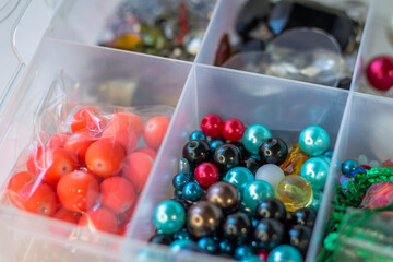 Various beads in a container. Handicraft items. Embroidery and beading. handmade