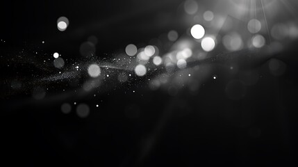Black and white abstract background with a smooth gradient and glowing particles.