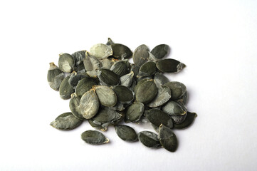pumpkin seeds on white background.