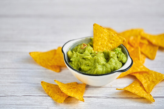 Avocado guacamole dip with tortilla nachos chips