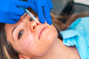 Close-up of a woman receiving a beauty treatment with collagen