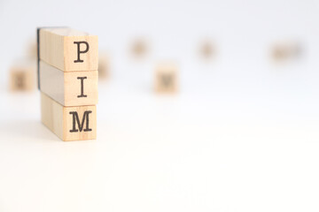 PIM acronym (Product Information Management) written on wooden cubes