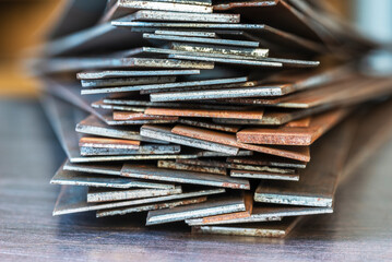 Stack of rusty steel flat bar close-up