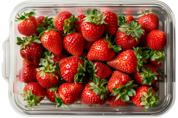 Strawberry package isolated on transparent background. View from top. Supermarket shop plastic box container with fresh sweet red fruits.
