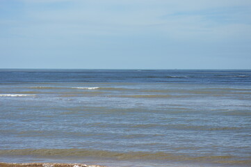 The beautiful blue sea at Aracruz beach on the coast of Espirito Santo, Brazil
