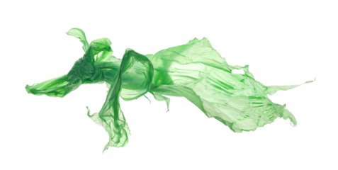 Green crumpled nylon bag flying isolated on white, clipping path