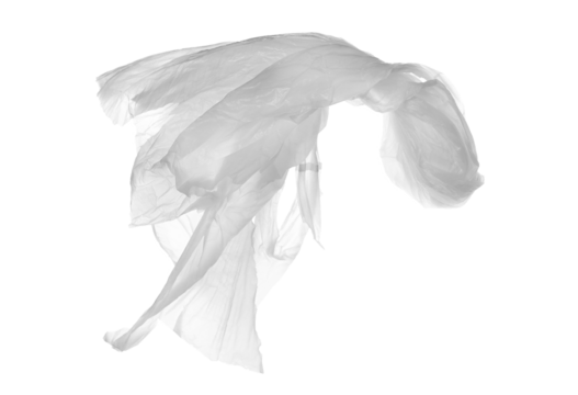 Crumpled nylon bag flying isolated on white, clipping path