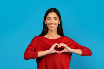 Woman Making Heart Shape With Hands