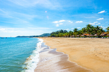 Nha Trang - Vietnam. December 13, 2015. Forming a magnificent sweeping arc, Nha Trang's 6km-long golden-sand beach is the city's trump card. - obrazy, fototapety, plakaty