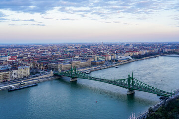 Fototapeta na wymiar Danube river with Liberty bridge or Freedom bridge in Budapest, embankment with city panorama