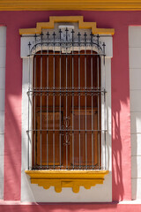 Traveling through Venezuela, long window of a colonial house in the historic center of Caracas