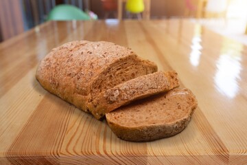 Multi grain bread with cut on a board
