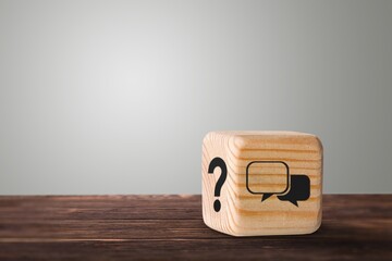 Question symbol on wooden cube. Recommendation concept.