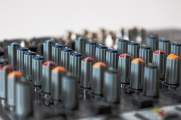 Fototapeta premium Potentiometers in different colours sound mixing console