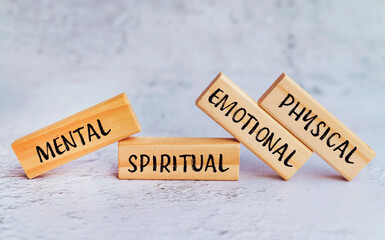 Mental ,spiritual ,emotional ,physical written on wooden blocks