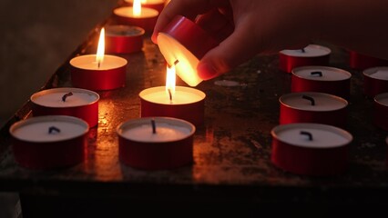 Caucasian Child Girl Lighting Up Wax Prayer Candle in Catholic Church