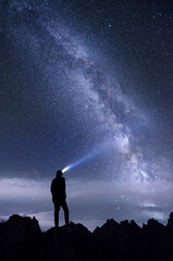 The milky way galaxy and a person's silhouette at nighttime in Koprovsky stit. 